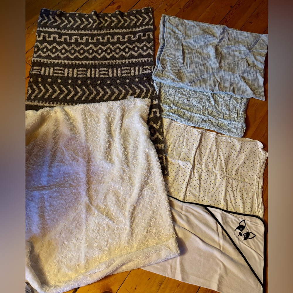 Assorted Cozy baby blankets and swaddles